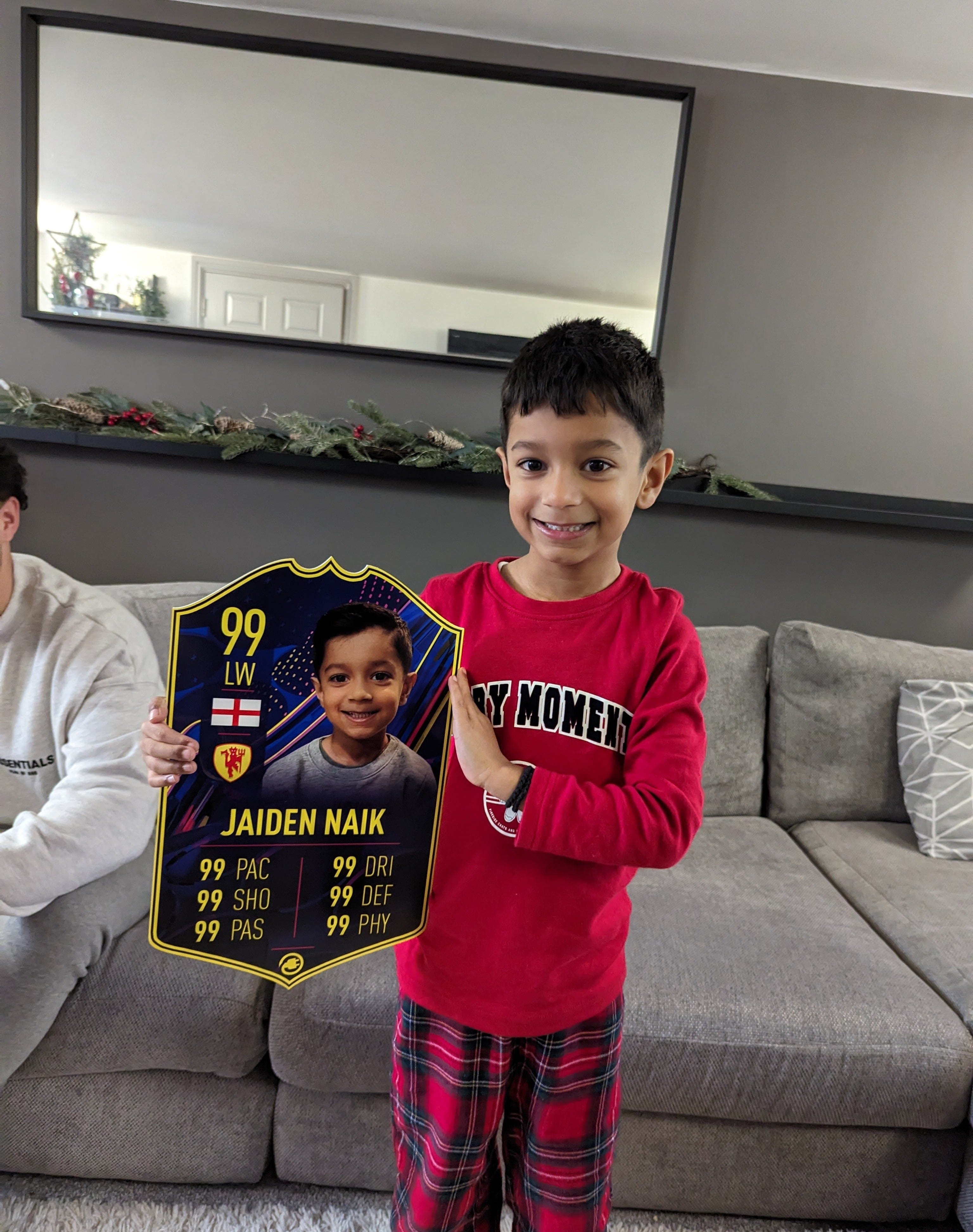 CardsPlug customer holding their personalised football card